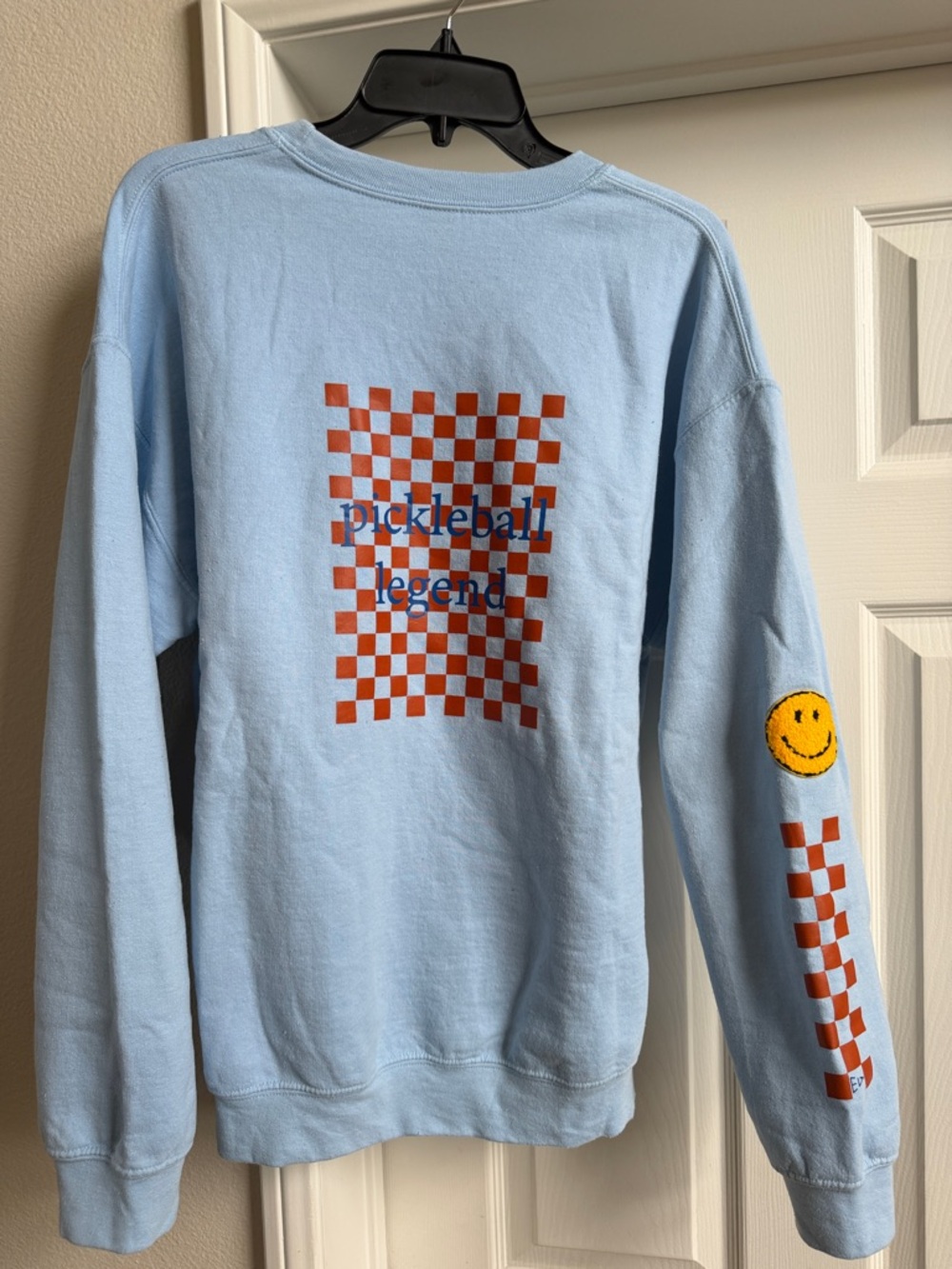 Pickleball Light Blue Crewneck with Red-Orange Checkerboard & Smile Patch EUC
